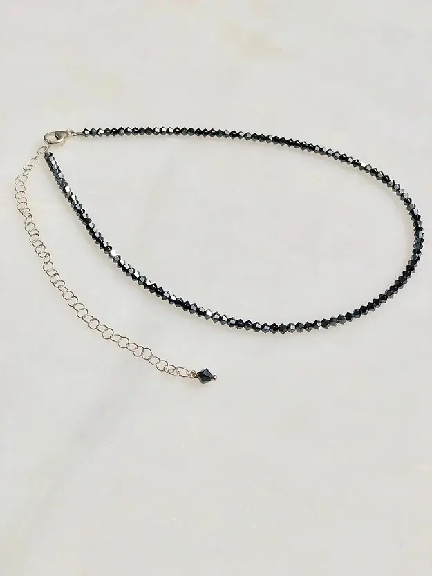 A Hematite Necklace/Choker with a silver chain.