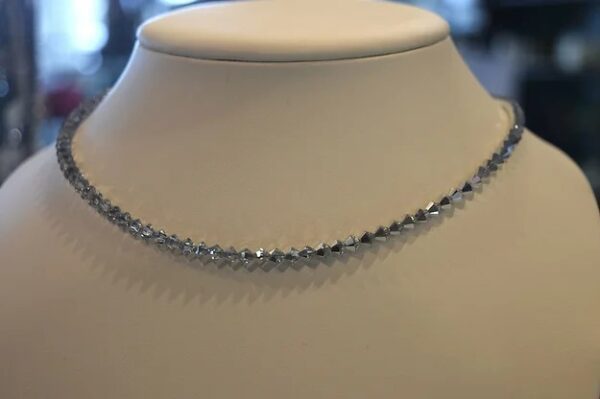 A 13-18" Comet Crystal Choker/Necklace with diamonds on a mannequin.