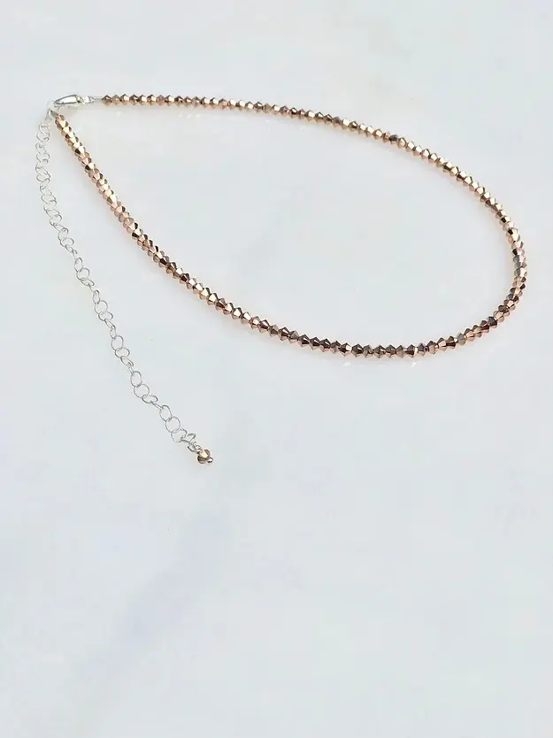 A 13-18" Rose Gold x2 Necklace/Choker with a silver chain.