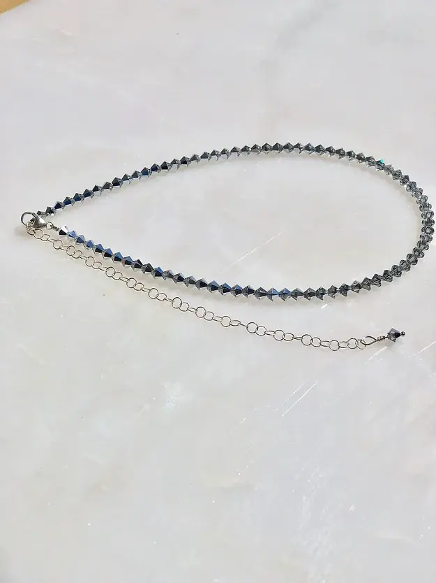 A 13-18" Comet Crystal Choker/Necklace with a blue labradorite bead and a silver chain.