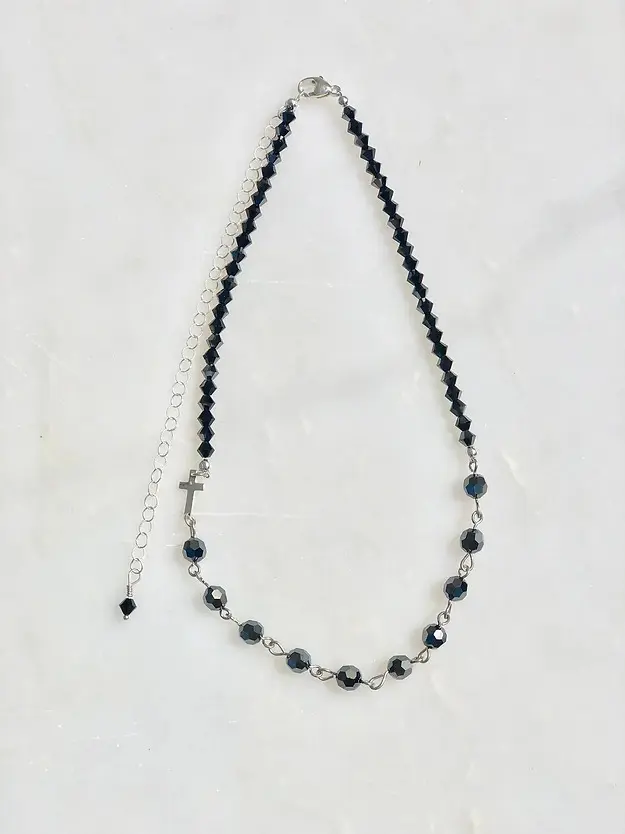 A 13-18" Hematite & Silver Rosary Necklace with a cross on it.
