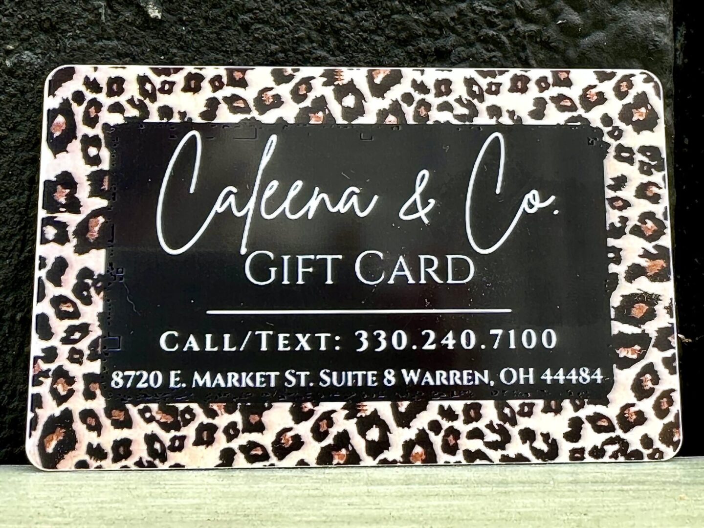 A $100 Caleena Gift Card *IN STORE use only* with a leopard print on it.
