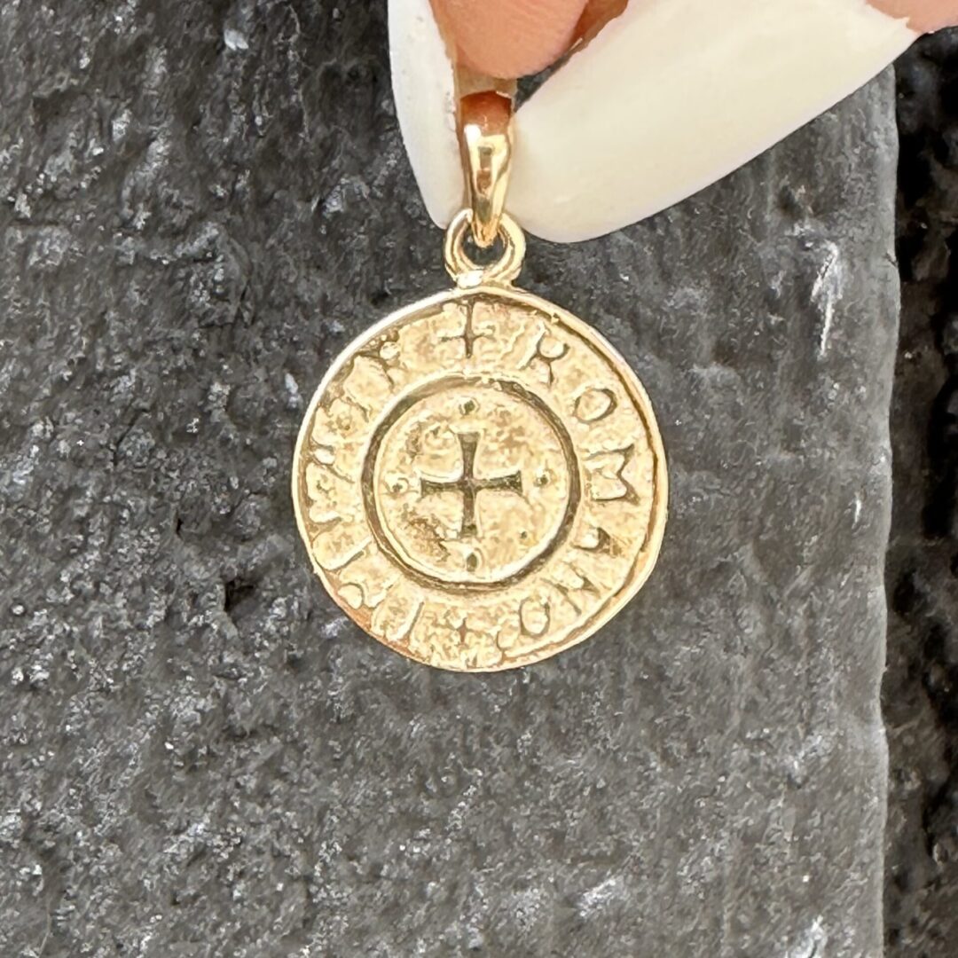 A person holding an Amalfi Coin * Special Order * pendant.