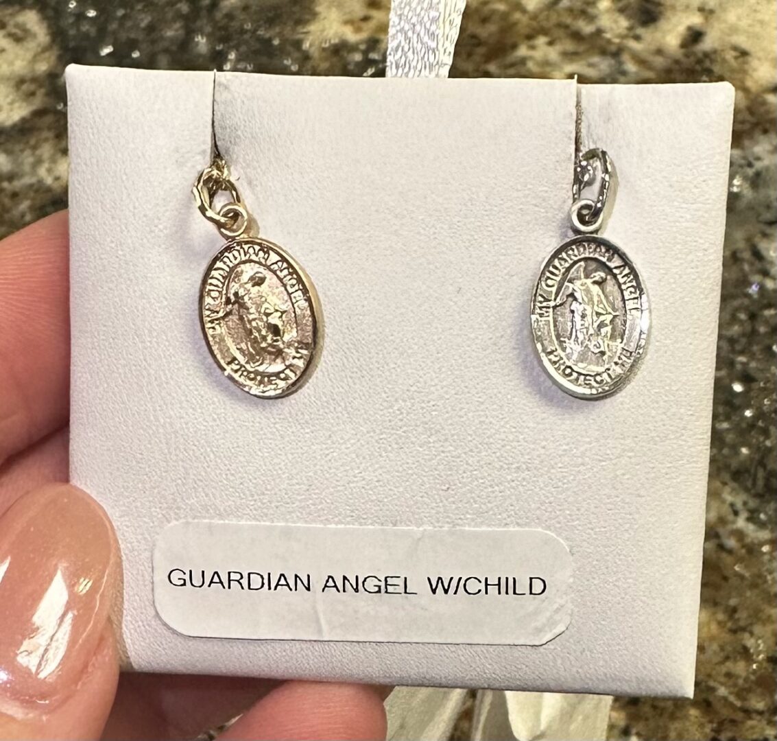 Guardian angel with child necklace earrings.