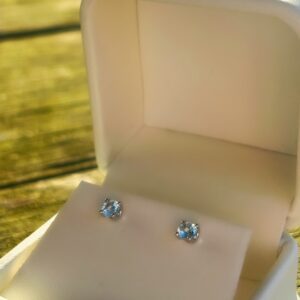 Aquamarine White Gold stud earrings in a white box.