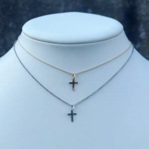 Two KIDS 10mm Cross Necklaces on a mannequin.