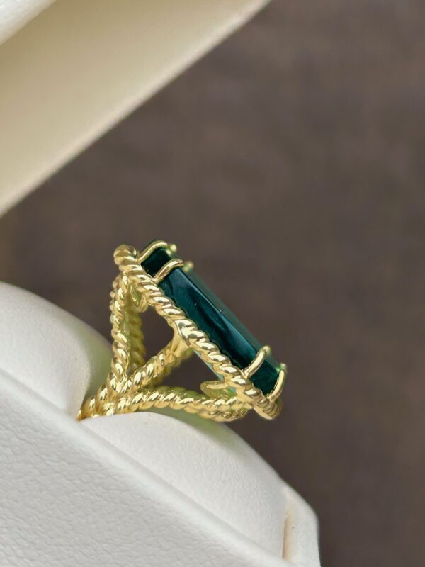 A Gold Venetian Glass Ring with an emerald cut stone.