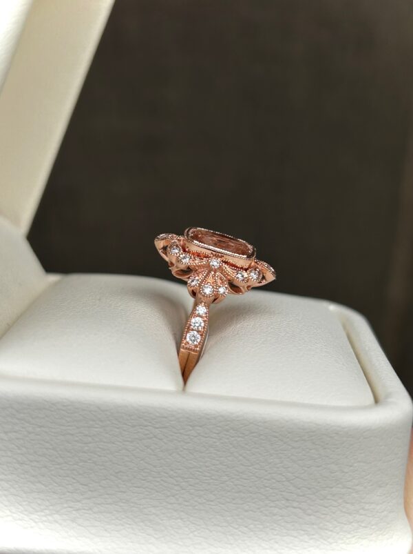 A Rose Gold Morganite Ring with diamonds.