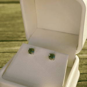 White Gold Green Diamond Studs in a white box.
