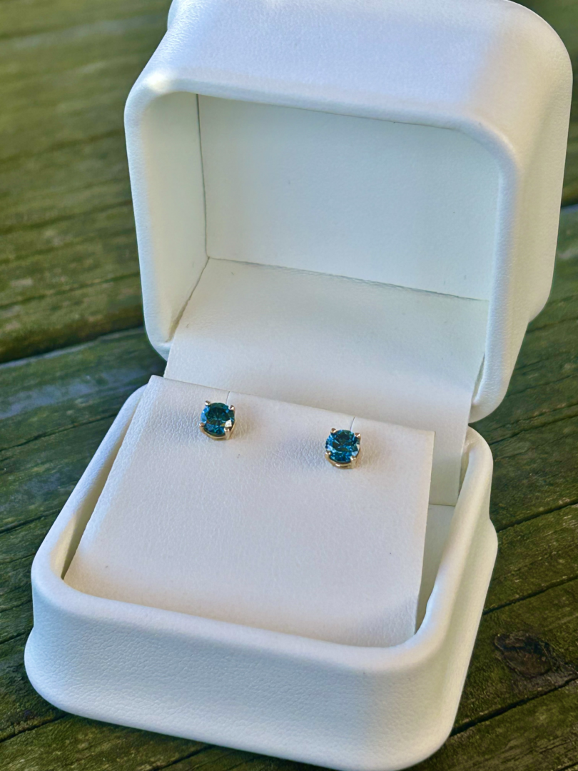 Gold Blue Diamond Studs in a white box.